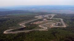 Aerial view of Masarykův okruh racing circuit with surrounding forest and buildings