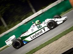 Formula 1 cars racing on the Brno Grand Prix track during a revival event