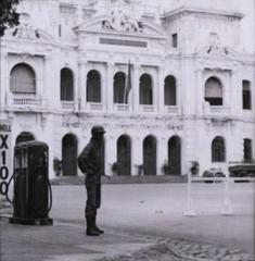 Coup soldier standing watch in front of Saigon City Hall during attempted coup