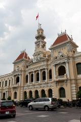 Ho Chi Minh City Hall in Vietnam at dusk with ornate French colonial architecture and illuminated clock tower