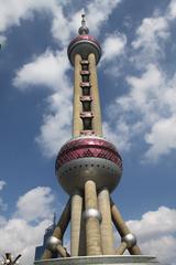 Oriental Pearl Tower in Shanghai at dusk with illuminated spheres