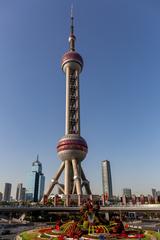 Oriental Pearl Tower in Shanghai at dusk with city skyline
