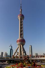 Oriental Pearl Tower in Shanghai at sunset with illuminated cityscape