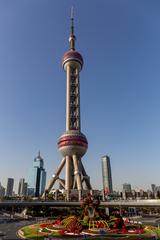 Oriental Pearl Tower in Shanghai at night illuminated with colorful lights