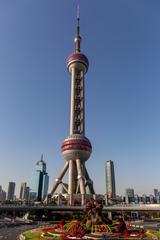 Oriental Pearl Tower in Shanghai illuminated at night with cityscape background