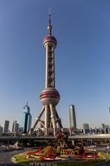 View of the Oriental Pearl Tower in Shanghai at dusk with surrounding city skyline