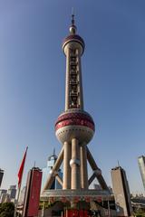 Oriental Pearl Tower in Shanghai at dusk with city lights