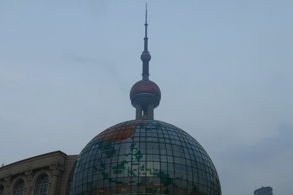 Shanghai International Conference Center and Oriental Pearl Tower illuminated at night in Shanghai, China