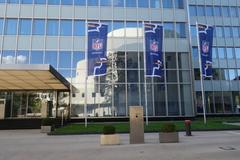 NFL Germany opens new headquarters in Düsseldorf with Dreischeibenhaus building and reflection of Schauspielhaus Düsseldorf