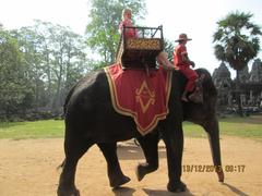 Tourists riding elephants at Angkor Thom Temple complex