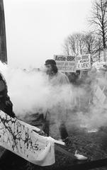 Black and white photo showing members of BBK demonstrators at the first pile driving for the Rijksmuseum Vincent van Gogh in Amsterdam with banners and incendiary bombs on November 25 1969