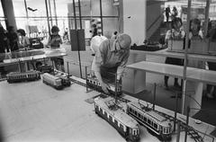 Models of old trams being placed at the Halte 75 exhibition at Van Gogh museum Amsterdam 1975
