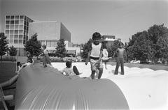 Children playing on a trampoline next to the Van Gogh Museum in Amsterdam