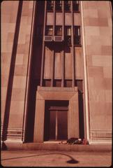 Homeless man sleeping on doorway of Penn Central's 30th Street Station
