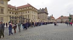 Queue of people at the entrance to St. Vitus Cathedral in Prague