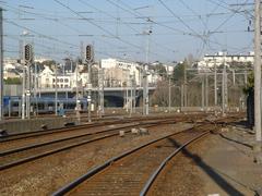 Front view of Gare de Brest railway station building with a clock tower under cloudy sky