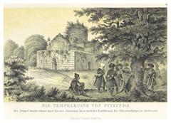 Ruins of an ancient temple in Pitsunda under a blue sky with greenery around