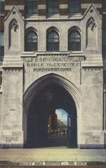 The Arch at Moody Bible Institute with intricate stonework and greenery