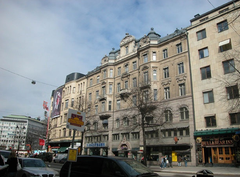 Office building on Stureplan, Stockholm with modern glass facade and surrounding cityscape