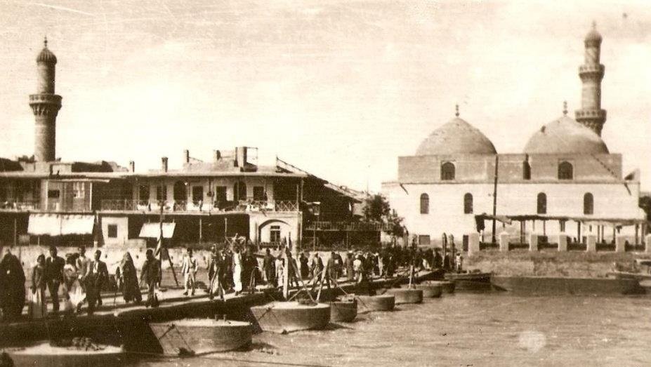 Historic Al Gat'a Bridge (Martyrs Bridge) in Baghdad with Al Asafia Mosque in the background, 1930