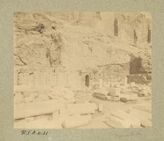View of the Doric stoa at the Sanctuary of Asclepius with ruins set against the Acropolis rock