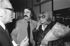 Melina Mercouri arriving at Schiphol Airport greeted by Andre van der Louw on October 25, 1974