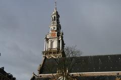 Exterior view of the Zuiderkerk church in Amsterdam with blue sky