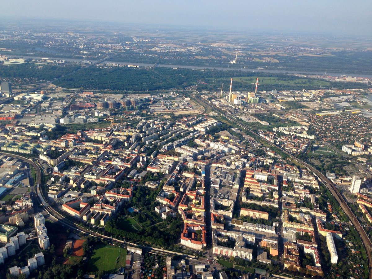 Aerial view of Simmering district in Vienna Austria with urban buildings and greenery