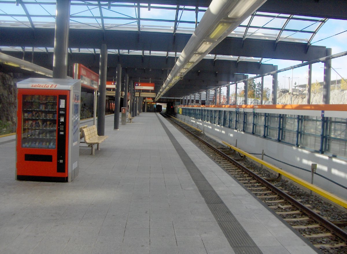 Rastila metro station platforms during the day with passengers