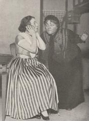 Scene from Act I of the Belgian comedy Le Cocu magnifique featuring Régina Camier as Stella and Henriette Mullo as the nurse
