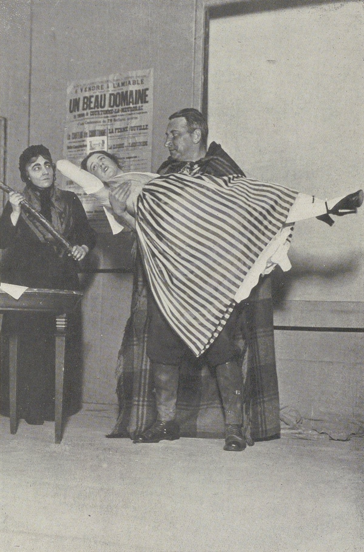 Scene from Act III of the Belgian comedy Le Cocu magnifique by Fernand Crommelynck with actors Régina Camier, Henriette Mullo, and Maraval at Théâtre de l'Œuvre Paris 1921
