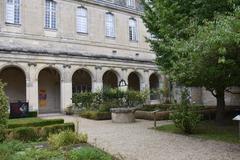 Cloister of the Saint-Martin Abbey in Laon, featuring historic arches and columns