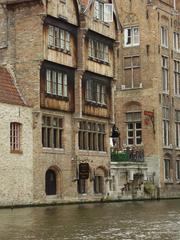 View of Bruges cityscape with medieval buildings and canals in summer