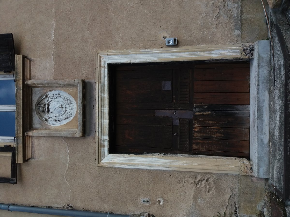 Stone door with carved coat of arms in Lyon