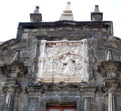 Baroque facade and reliefs detail on the upper portal of Colegio Grande at San Ildefonso College in historic center of Mexico City