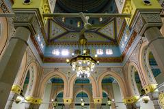 Interior view of Jumeirah Mosque with intricate Islamic architecture and decorative lighting