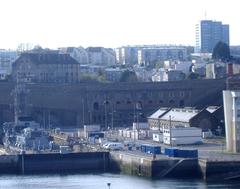 Bâtiment aux Lions in Brest with the ASM Primauguet frigate docked at basin 3, old Madeleine prison, Pontaniou forges, and Quéliverzan towers