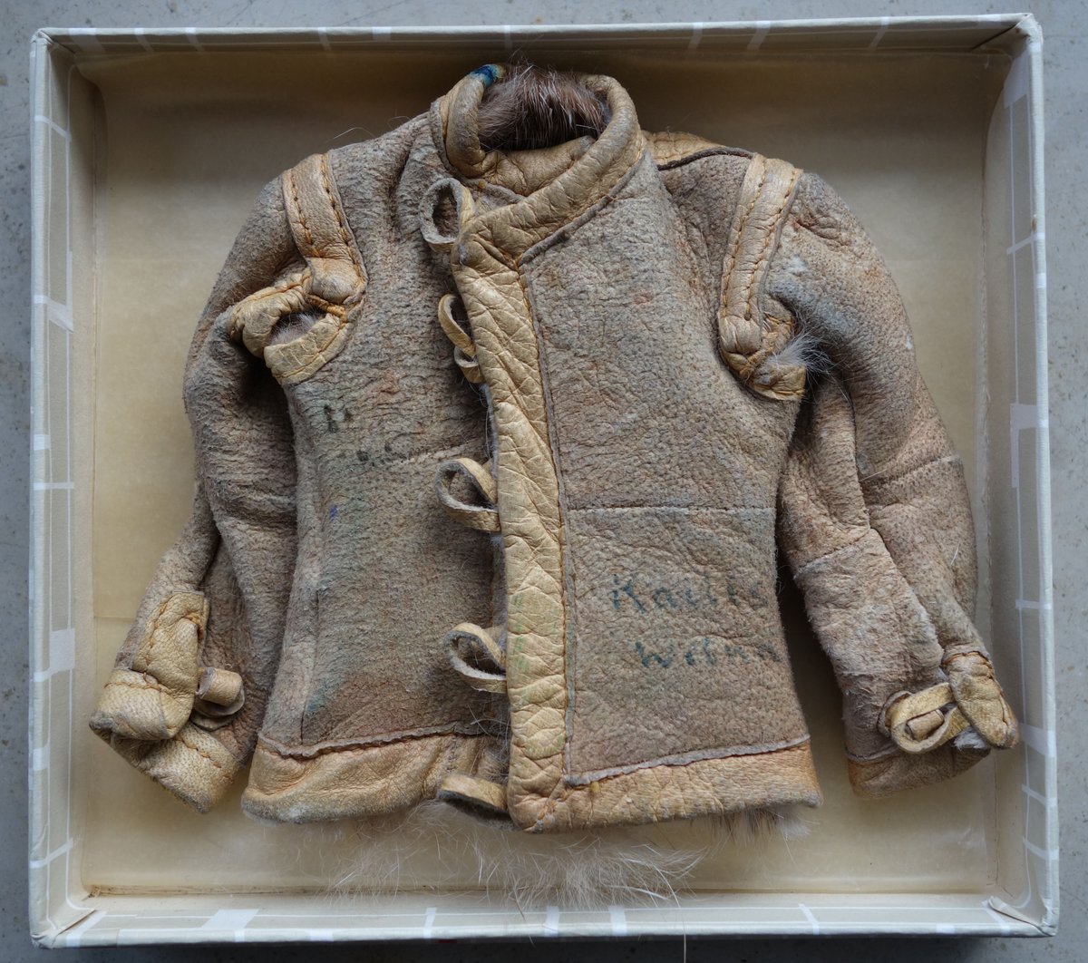 Kaninfell miniature jacket labeled Kailis Wilna from a furrier's collection during WWII in Lithuania