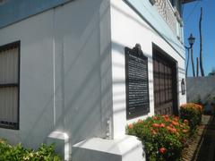 Facade and interior of Baldomero Aguinaldo Shrine with fences and tombs of Baldomero and Petrona Reyes in Binakayan, Kawit, Cavite