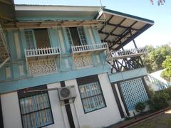 Facade of Museo ni Baldomero Aguinaldo y Baloy with fences and interior tombs of Baldomero and Petrona Reyes in Binakayan, Kawit, Cavite