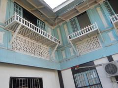 Facade and interior of Baldomero Aguinaldo Shrine museum with fences and tombs in Binakayan, Kawit, Cavite