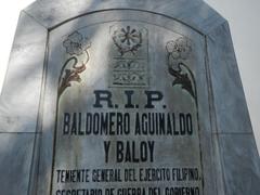 Facade of Baldomero Aguinaldo Shrine with fences and interior tombs in Binakayan, Kawit, Cavite