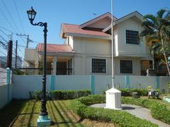 Facade and interior of Baldomero Aguinaldo Shrine with fences and tombs in Binakayan, Kawit, Cavite