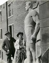 Irving K. Pond and sculptor Murphy examining the Athletics statue at Michigan Union