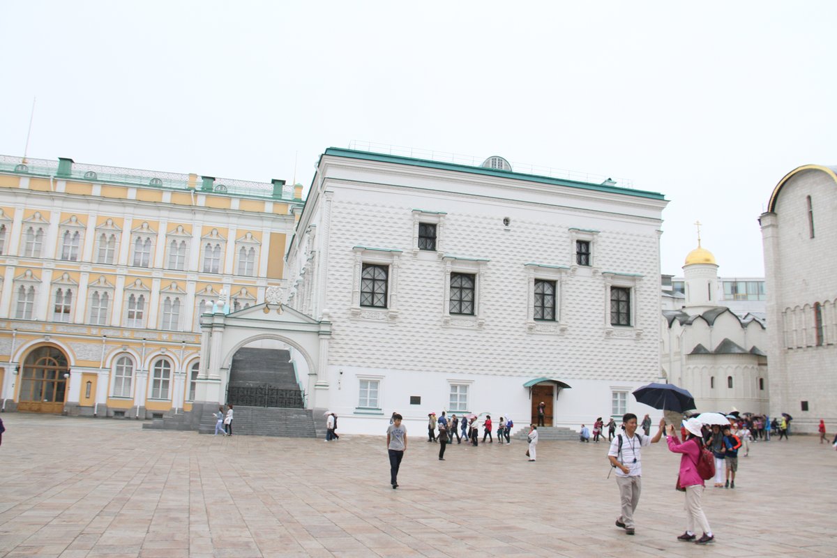 Summer street scene in Moscow with historic buildings and people walking in August 2016