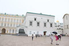 Summer street scene in Moscow with historic buildings and people walking in August 2016