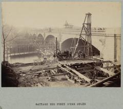Construction site of Austerlitz Bridge extension with pile driving in progress