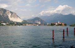 View of Lake Maggiore from Isola Bella with Isola dei Pescatori, town of Baveno, Camoscio mountain, Monte Orfano, and Alps in the background