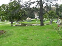 Garden of Ihlamur Palace with ornate white structures and lush greenery in Istanbul Turkey