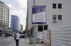 August 2015 sunset cityscape in Tel Aviv with modern buildings and Mediterranean Sea